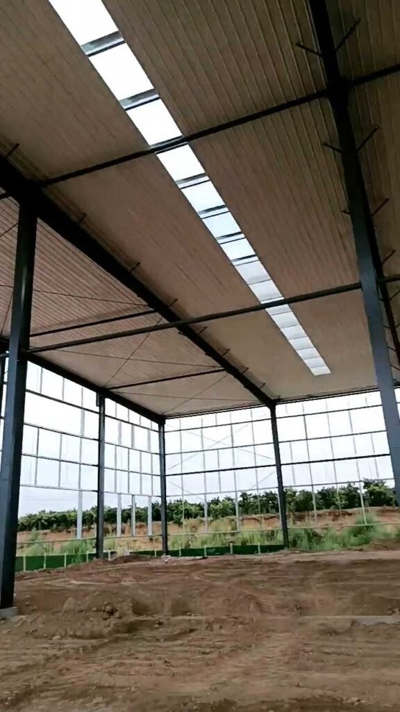 Interior of a corrosion resistant warehouse with H-beam framing and white anti-corrosive coating for tropical climates