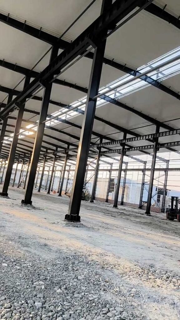 Custom steel structure featuring heavy-duty H-beam columns and a modular portal frame system for maximum durability