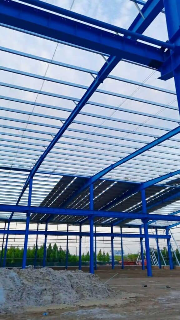 View of precision-fabricated roof trusses and rafters for an engineering and fabrication project of a large-scale warehouse.