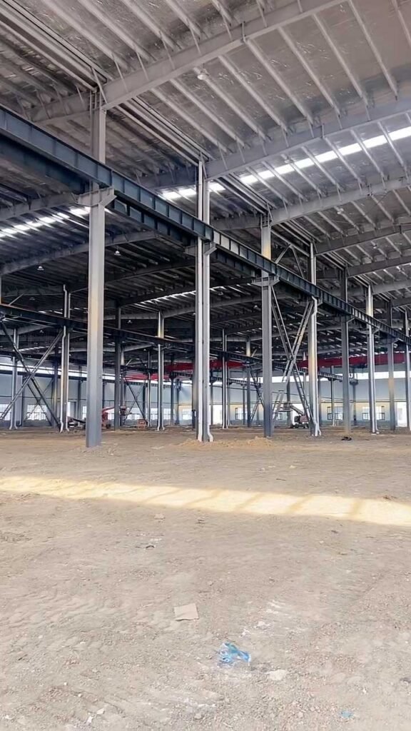 Detailed interior view of a steel warehouse highlighting the insulated roofing system and structural trusses designed for extreme Canadian winters.