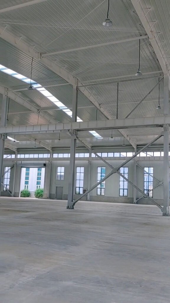 Structural framing details including wall girts and column cross-bracing, fabricated precisely by a direct steel warehouse manufacturer for maximum structural stability.