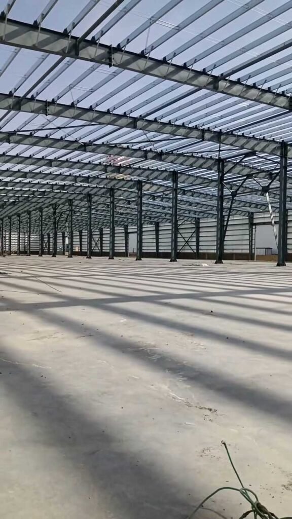 Long industrial bay sequence with precise column spacing produced by a global prefabricated warehouse supplier.
