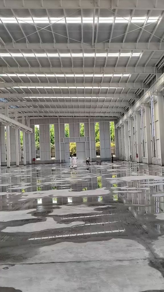 Wide clear-span interior of a commercial project, engineered, fabricated, and exported as a private label steel building for an overseas distributor.