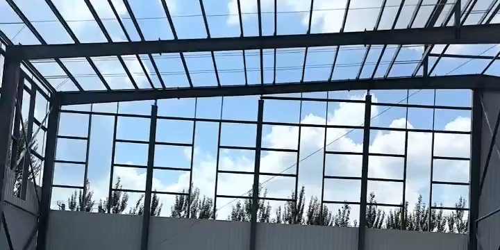 View of primary roof framing and purlin installation, showcasing the precise engineering support provided to partners in our steel building dealership network.