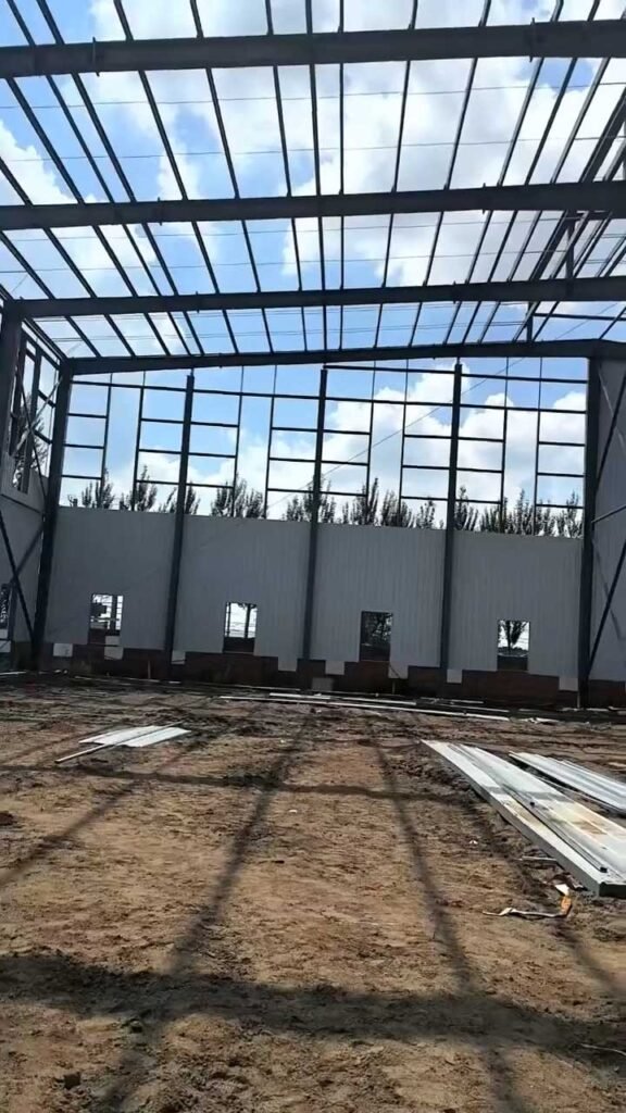 Expansive clear-span interior of a commercial building, highlighting the scalable structural solutions available to a regional steel warehouse distributor.