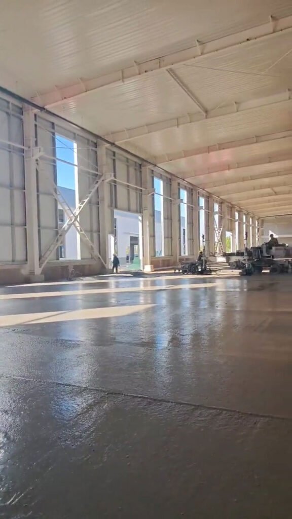 Steel warehouse structural engineering showing wide clear span and wall bracing members.